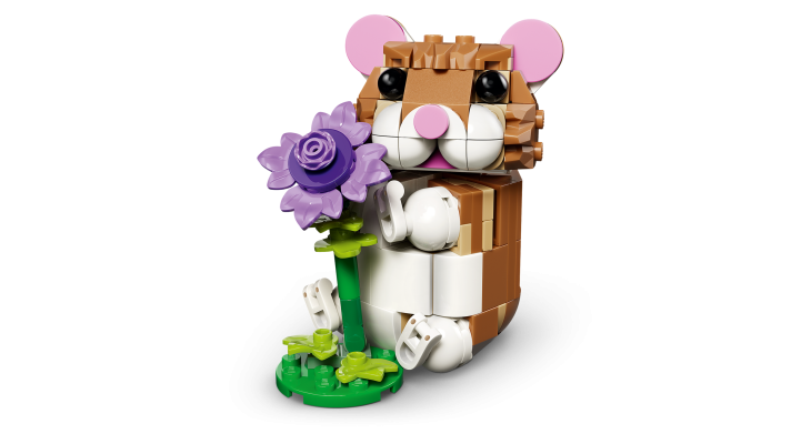 Schattige hamster met bloem